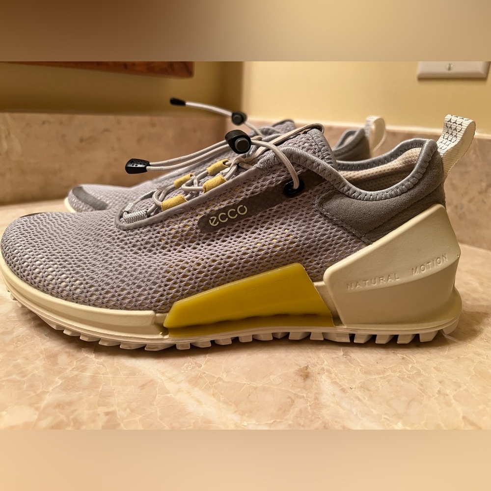 ECCO Biom 2.0 Breathru cross-trainer shoes with gray with yellow accents.